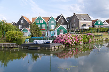 Obraz premium Typical Dutch village scene with wooden houses on the island of Marken in the Netherlands, Holland