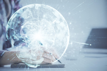 International business hologram over hands taking notes background. Concept of success. Multi...