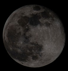 Super full moon on black night sky