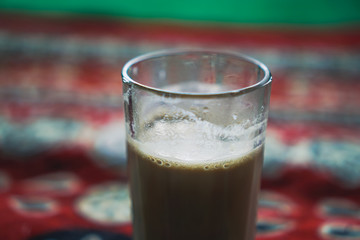 Glass of Tea in Indian Style with Blur Background