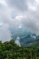 Fototapeta premium beautiful blue sky high peak mountains mist fog wildlife green forest at Khao Koh, Phu Tub Berk, Phetchabun, Thailand guiding idea long weekend for backpacker camping campfire relaxing hiking