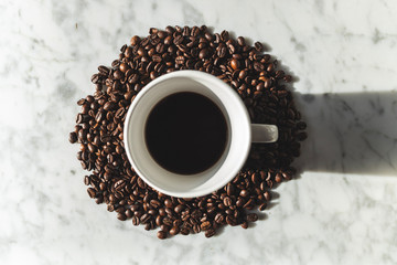 Coffee beans wallpaper with italian coffee pot on white marble