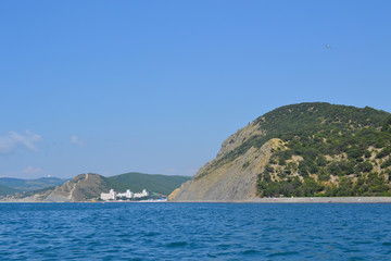 Fototapeta premium Mountains and sea near the city, summer painting