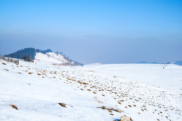sun over the winter mountains with snow, Cindrel mountains, Paltinis, Romania
