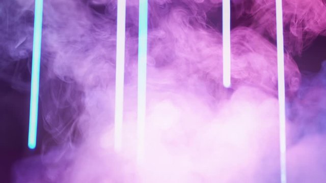 Smoke creative background. Nightclub show. Grape compote purple steam motion on blue neon lights.