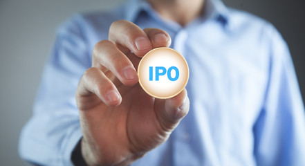 Man showing IPO word in coin.