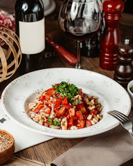 light salad of tomatoes, nuts and onions