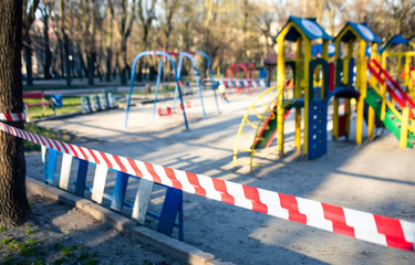 

empty playgrounds, fenced, pandemic, quarantine, ban on walking for children, ban on walking on playgrounds

