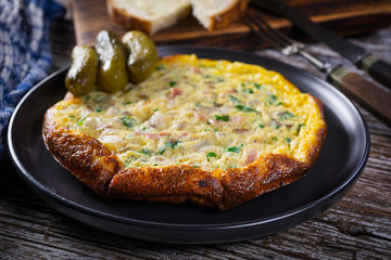 Omelette with ham and parsley.