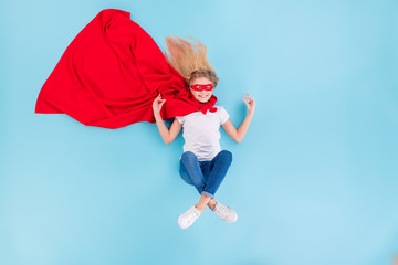 Fototapeta na wymiar Top above high angle view photo of peaceful kid superhero meditate lay show om symbol wear red mantle mask denim jeans white t-shirt isolated over blue color background