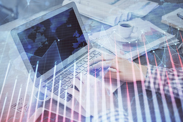 Fototapeta na wymiar Double exposure of forex graph with man working on computer on background. Concept of market analysis.