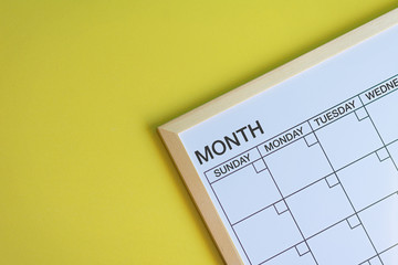 Calendar blackboard (empty) in a yellow desk