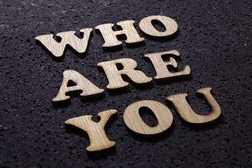 Who are you, business motivational inspirational quotes; wooden words typography lettering concept