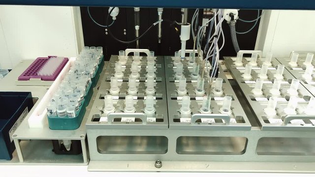 Close up view of medical test been doing in laboratory. Automatic medical analysis doing with special equipment. Concept of healthcare and diagnostic, illness treatment.