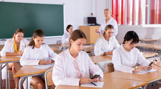 Medical Students Using Smartphones At Class