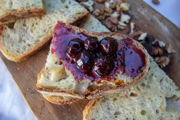 sourdough homemade bread. With nuts and dried apricots. Cherry jam