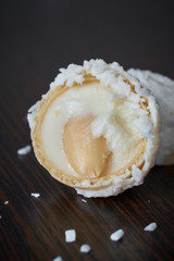 Raffaello candy broken into two halves close-up