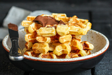 Belgian or american waffles (delicious sweet dish, dessert snack) menu concept. background. top view. copy space for text