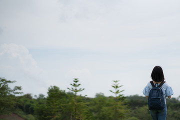 young cute Japanese Asian hipster girl travelling at beautiful sky 
mountains scenery park hiking garden views at Kanchanaburi Thailand guiding idea for female backpacker woman women backpacking