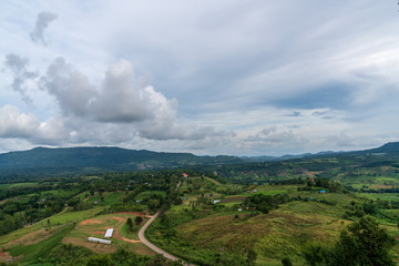 Obraz premium beautiful blue sky high peak mountains mist fog wildlife green forest at Khao Koh, Phu Tub Berk, Phetchabun, Thailand guiding idea long weekend for backpacker camping campfire relaxing hiking