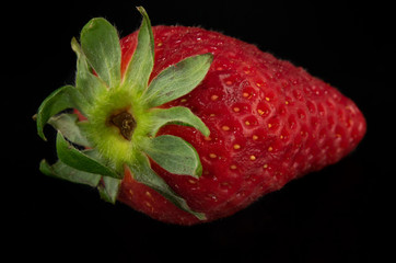 strawberry fruit close up shoot  
 black background 