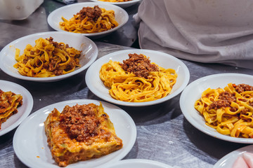 Italian food served in restaurant in historic part of Bologna city, Italy