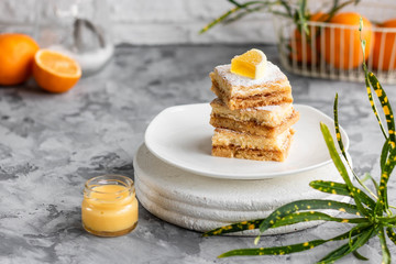 Lemon bars on a shortcrust pastry. A simple dessert for the summer