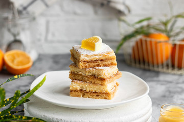 Lemon bars on a shortcrust pastry. A simple dessert for the summer