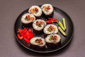 Korean roll Gimbap(kimbob). Steamed white rice (bap) and various other ingredients. Trendy black background