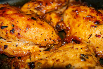 Chicken breast baked with spices. Surface texture. Close up.