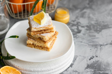 Lemon bars on a shortcrust pastry. A simple dessert for the summer