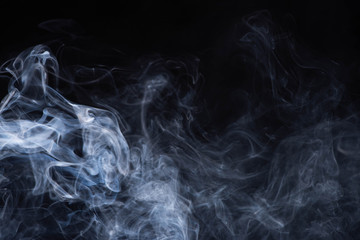 white flowing smoke cloud on black background with copy space