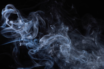 white flowing smoke cloud on black background