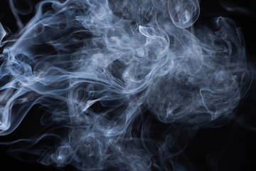 white flowing smoke cloud on black background