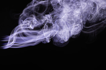 Fototapeta premium purple colorful flowing smoke on black background