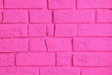 background wall of pink color decorative textured bricks