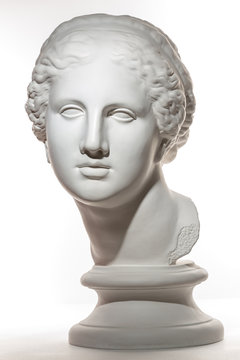 Gypsum copy of ancient statue Venus head isolated on white background. Plaster sculpture woman face.