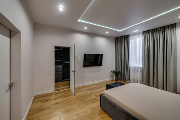 Interior of a modern loft style apartment. Spacious bedroom