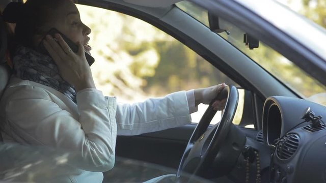 A Scared Woman Gets Into A Traffic Accident While Talking On The Phone, Driving Safely And Accurately