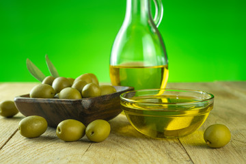 olive oil in transparent bowl with fresh olive