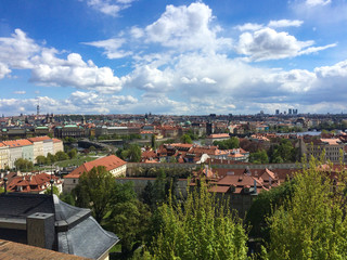 Fototapeta na wymiar view of Prague from above from the bridge on a Sunny day with sky and beautiful clouds