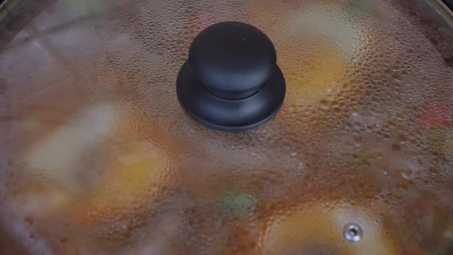  Close up shot of cooking tomato sauce. simmering or boiling liquid