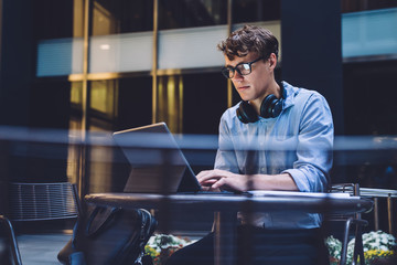 Young male using tablet at workplace
