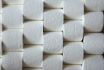 Vertical toilet paper rolls stacked, background