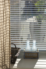 Rustic home decor on window with blinds
