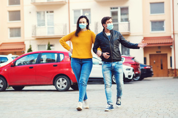 Couple in medical mask to prevent infection from spreading of Covid-19. Coronavirus quarantine.