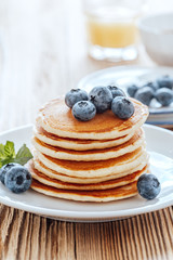 Homemade pancakes, fresh summer berries, coffee and juice