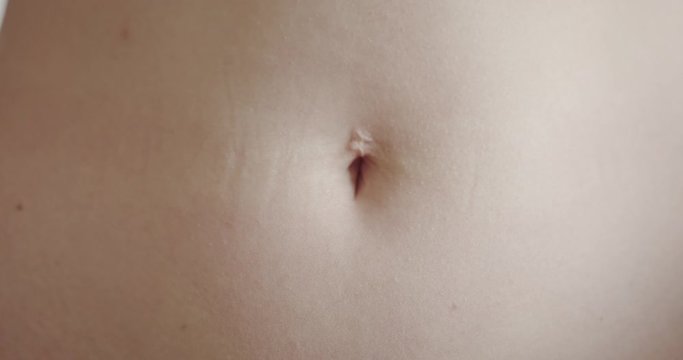 close up of a girl showing belly fat