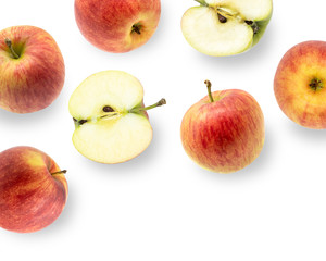 Ripe red apples with slices isolated on white background top view. Flat lay pattern