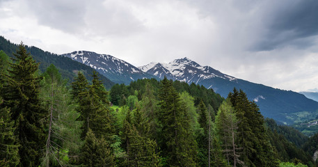 Fototapeta premium Panoramic view to the mountains. Snow covered Alps mountains on background. Switzerland, Europe.